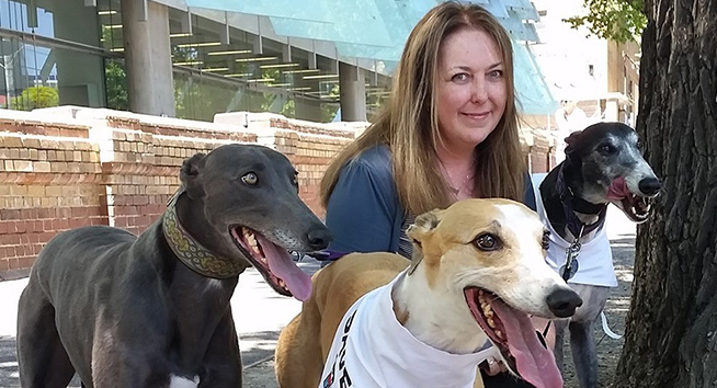 Vale Helen Marston. Helen with some beloved rescued greyhounds.