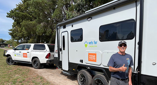 Vets For Compassion vet Dr Chris Barton with the new mobile vet clinics we've supported.