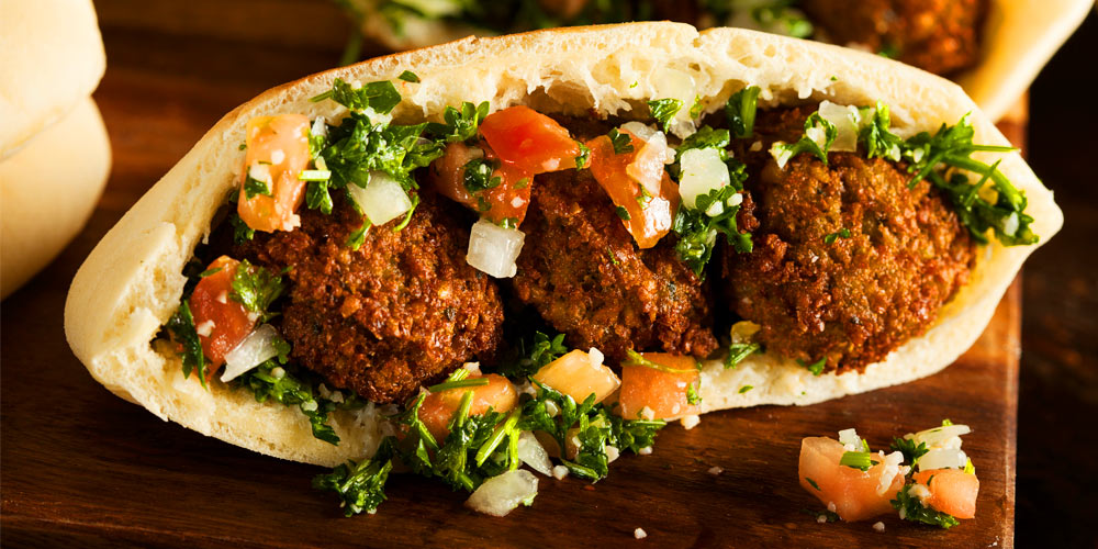 Crunchy falafel wrap with fresh tabbouleh and hummus.